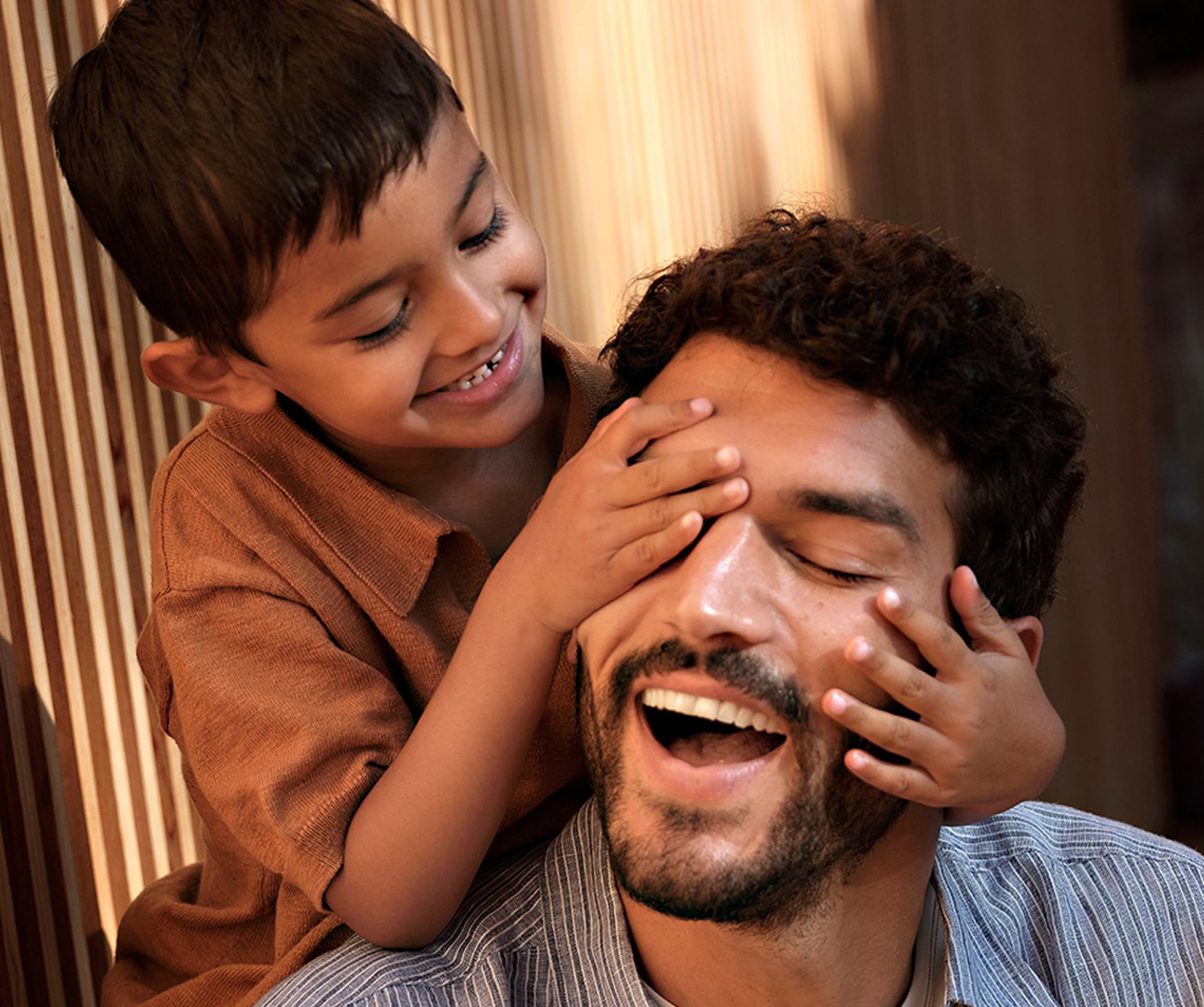 a child touching a man's face