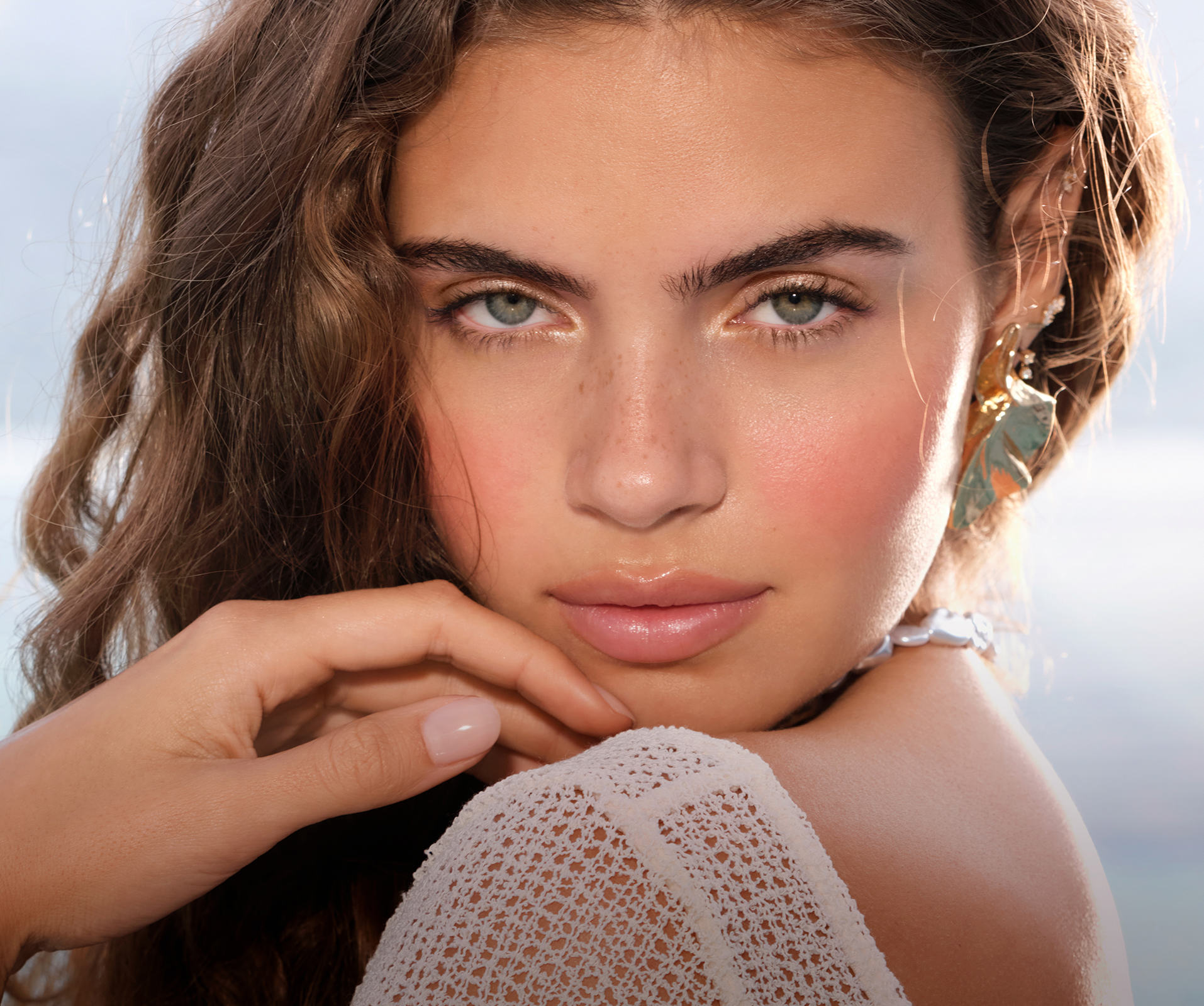 a woman with her hand on her chin
