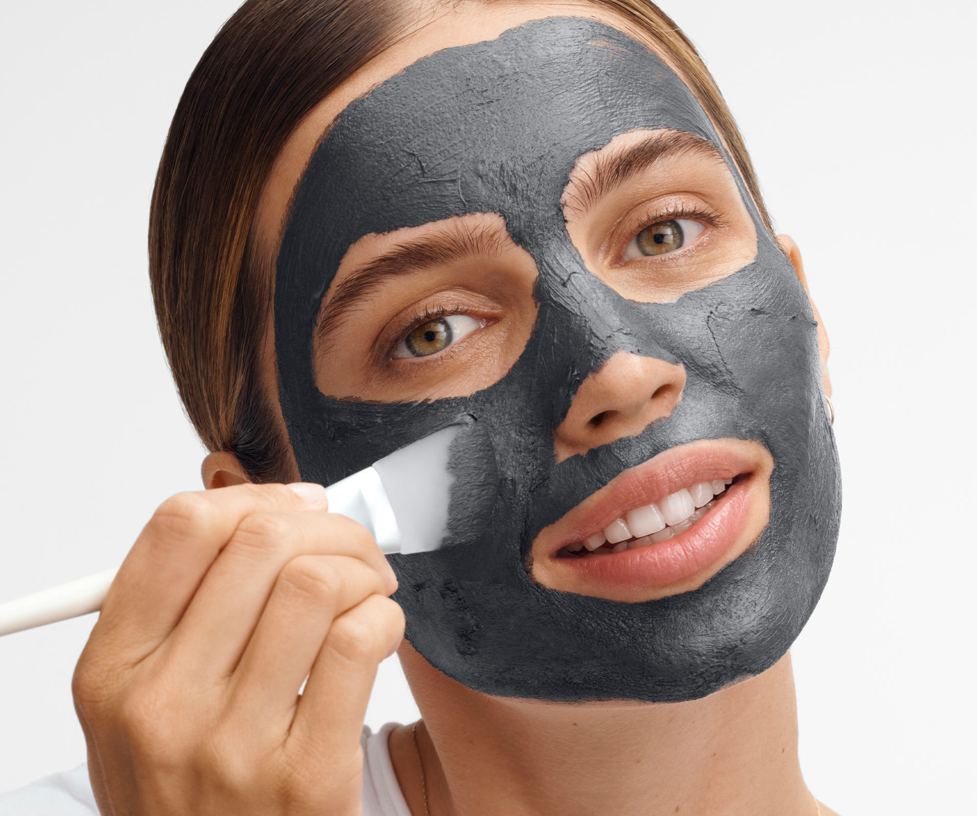 a woman with a black mask on her face
