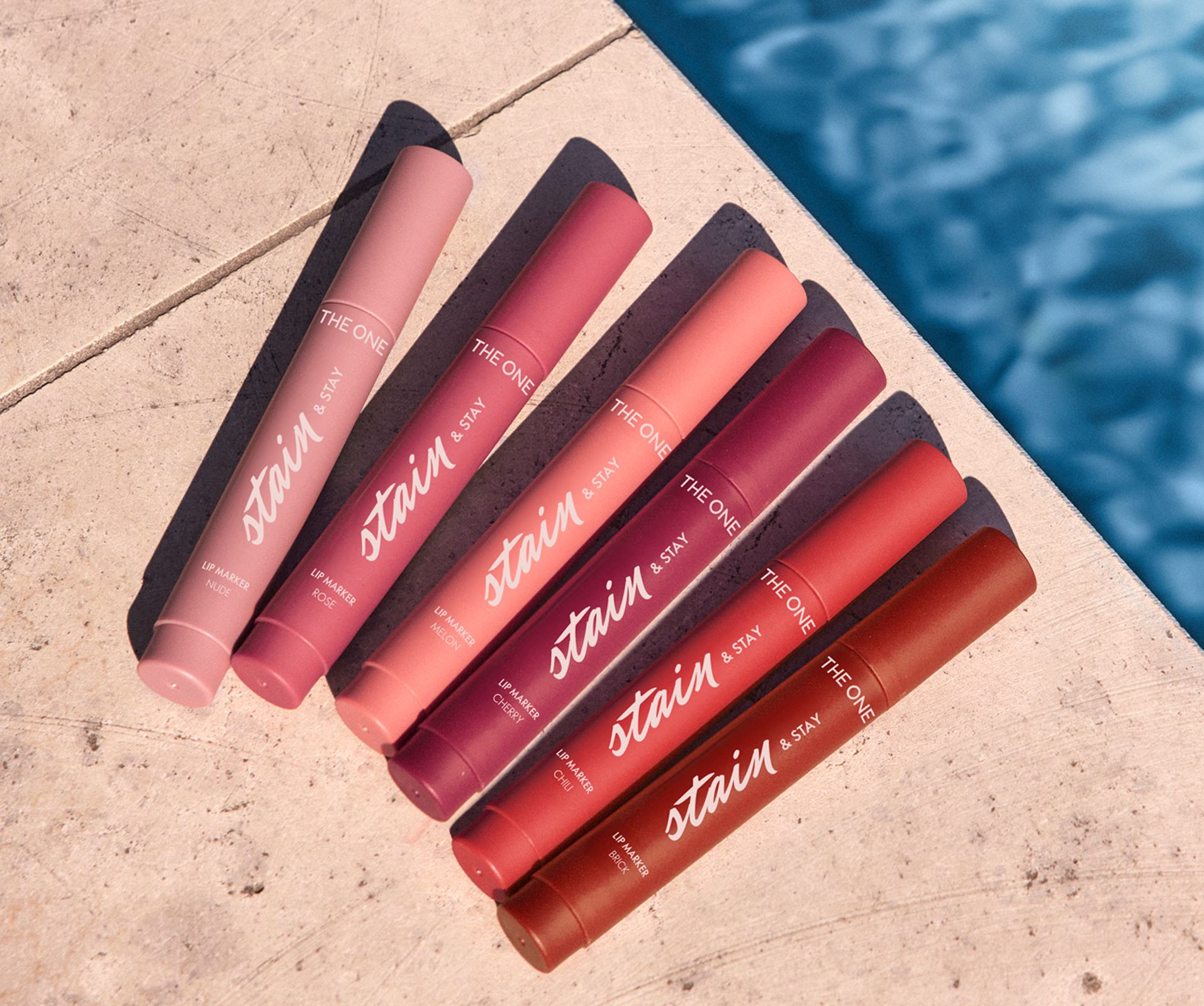 a group of lipsticks on a ledge