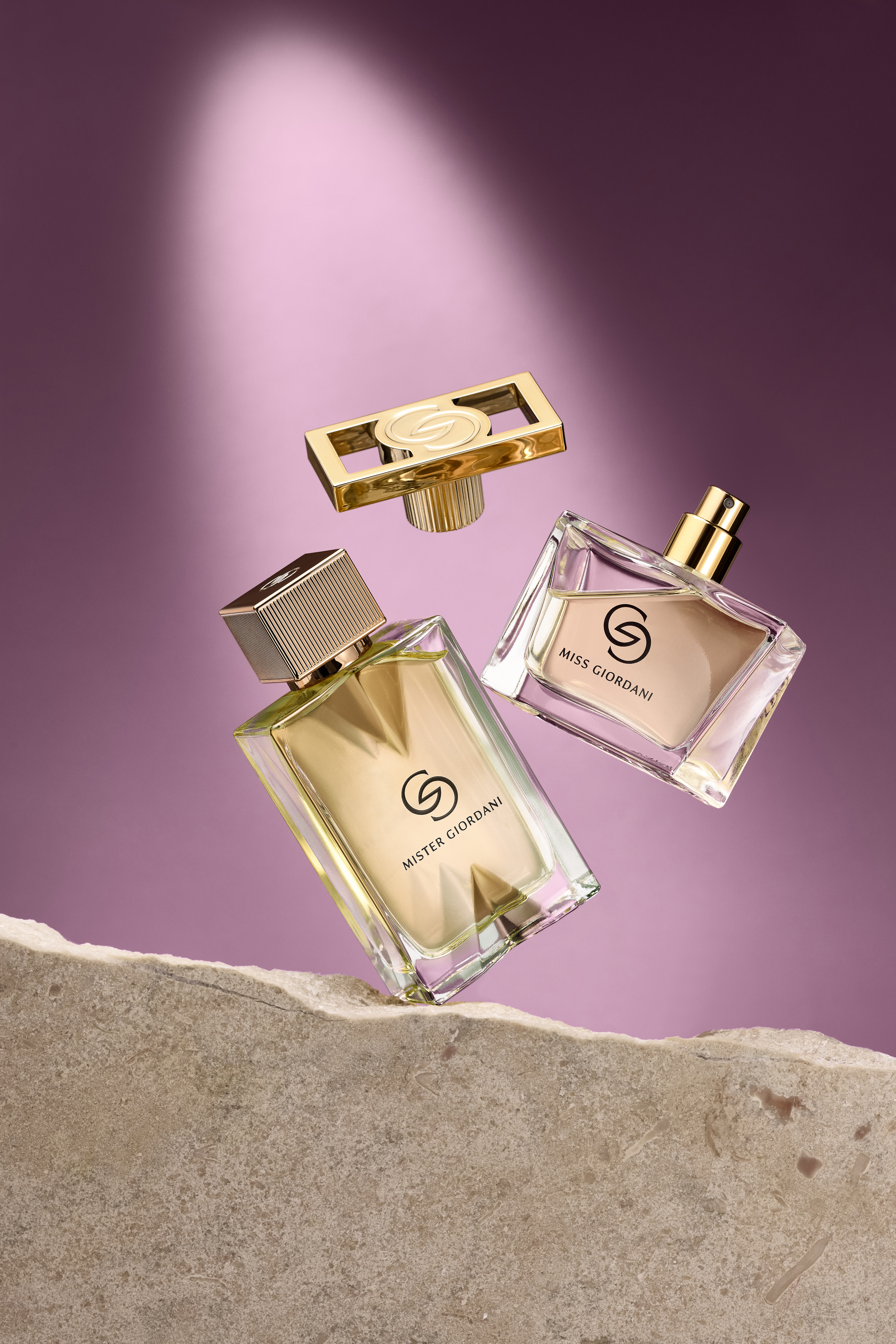 a group of perfume bottles flying in the air
