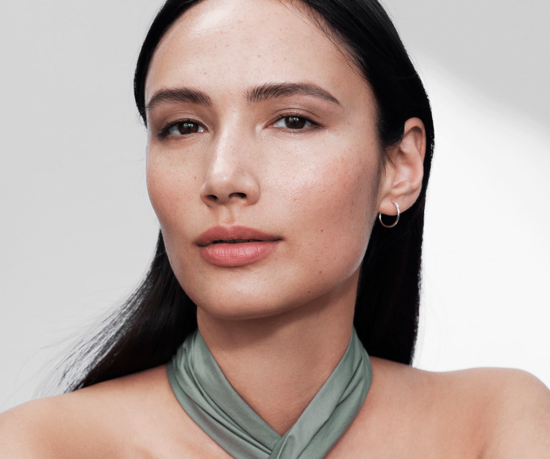 a woman with a scarf around her neck