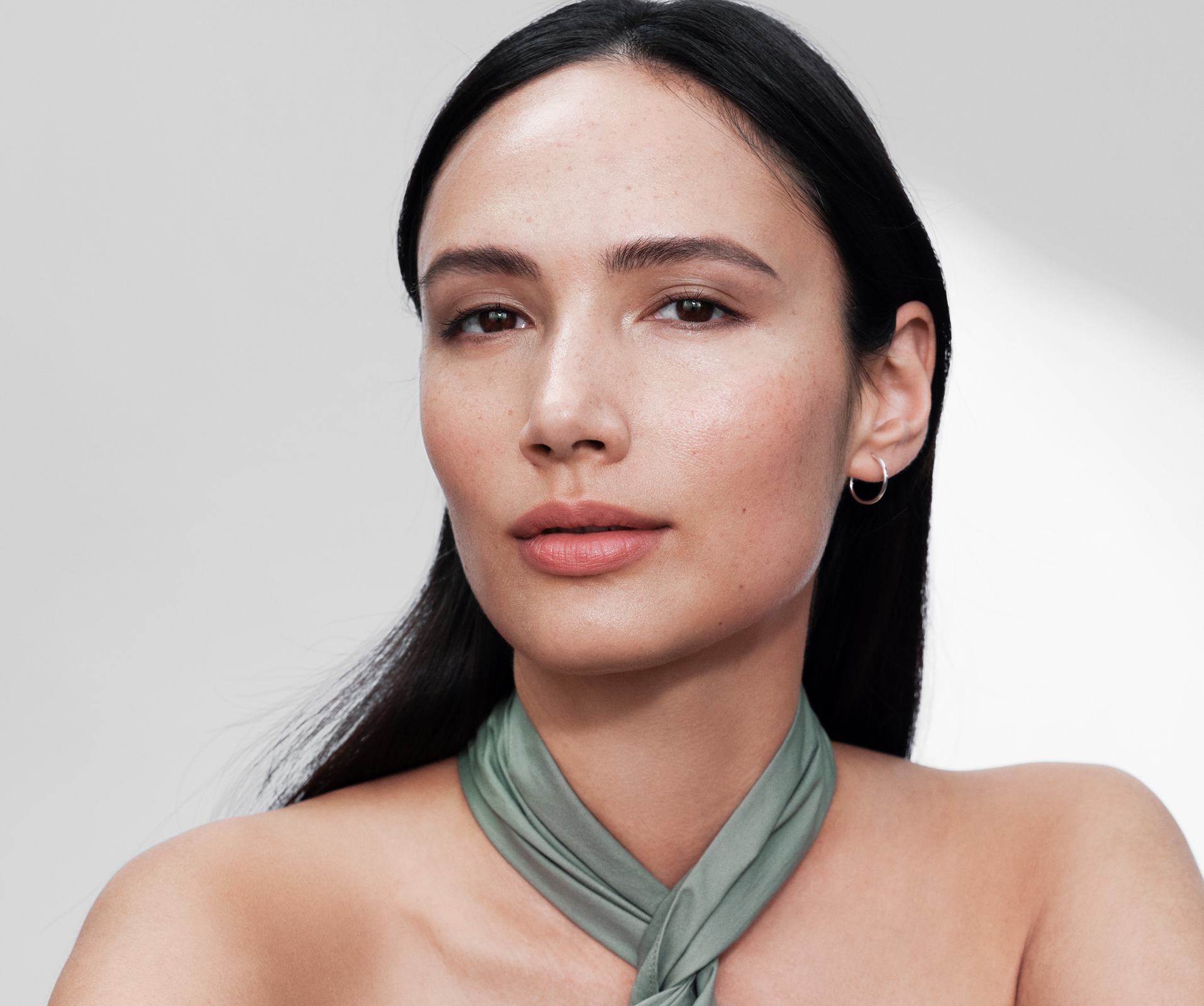 a woman with a scarf around her neck