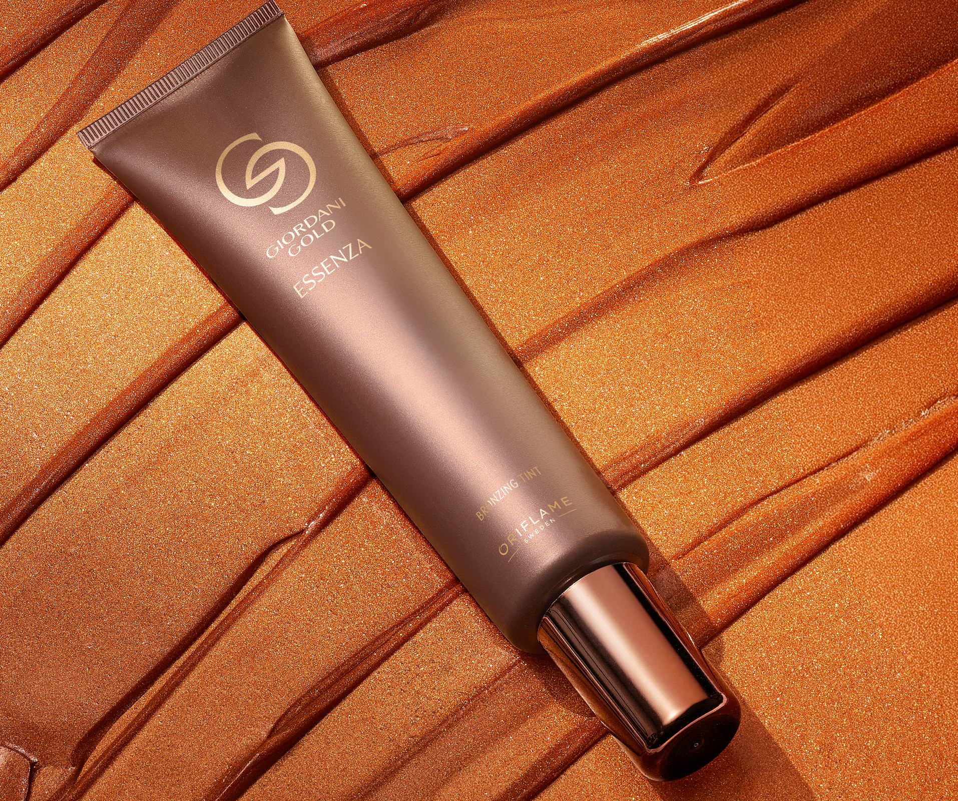 a tube of foundation on a brown surface