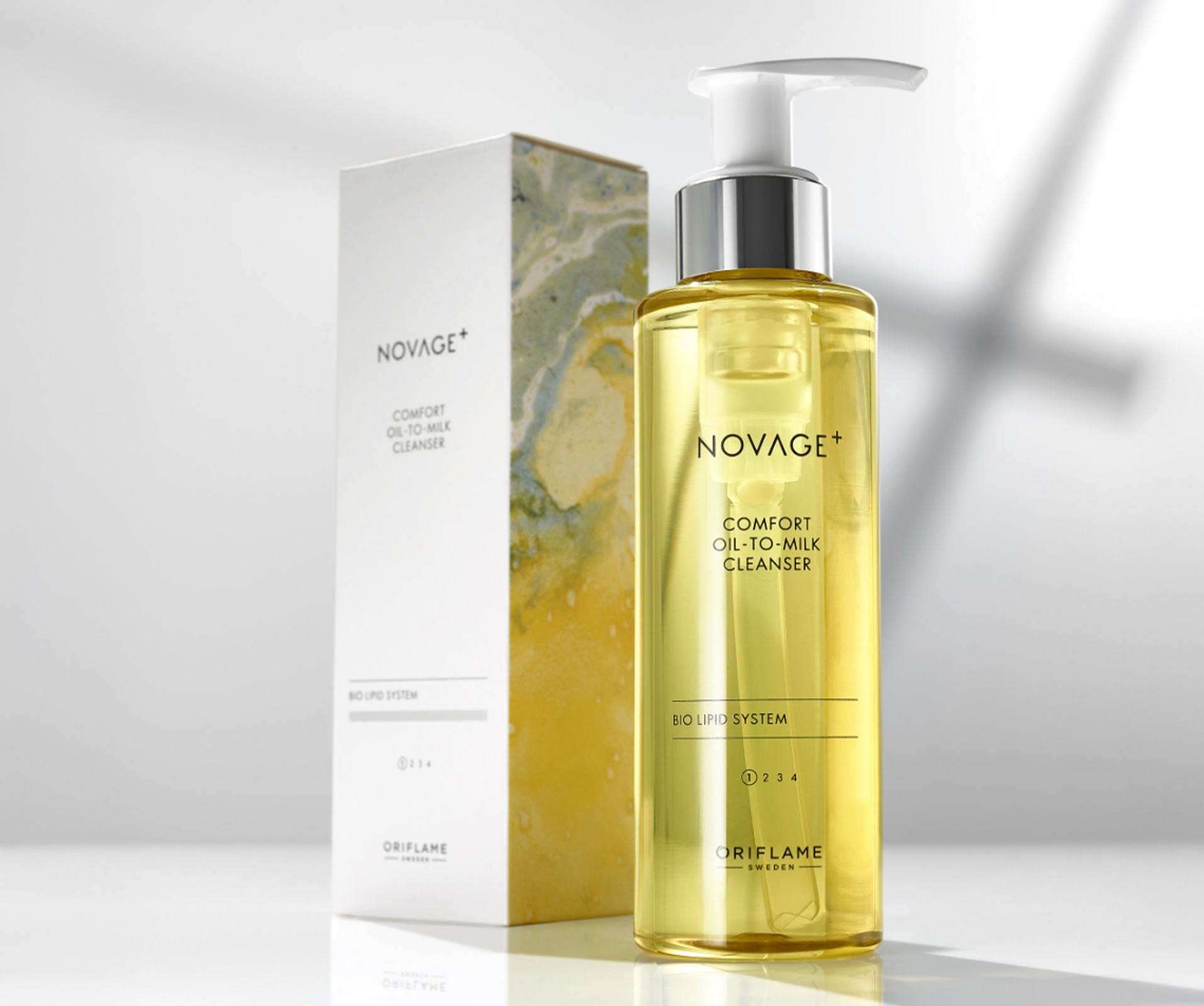 a bottle of oil with a white box