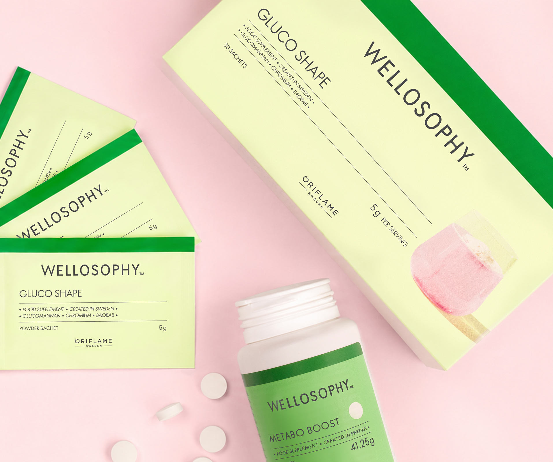 a white bottle next to green envelopes and white pills