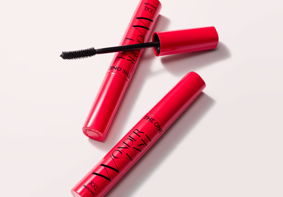 a red tube with a black brush in it