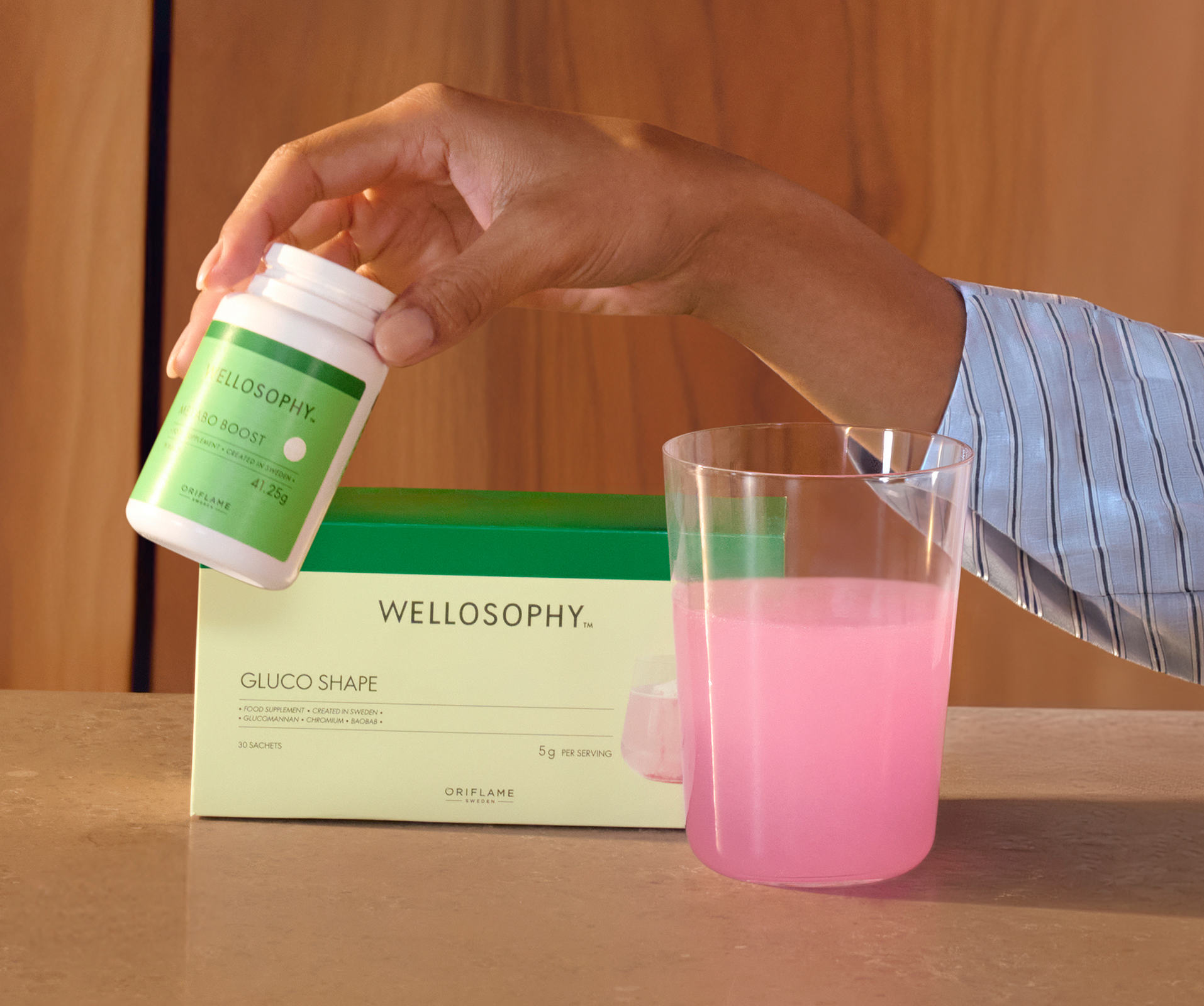 a hand holding a bottle of medicine