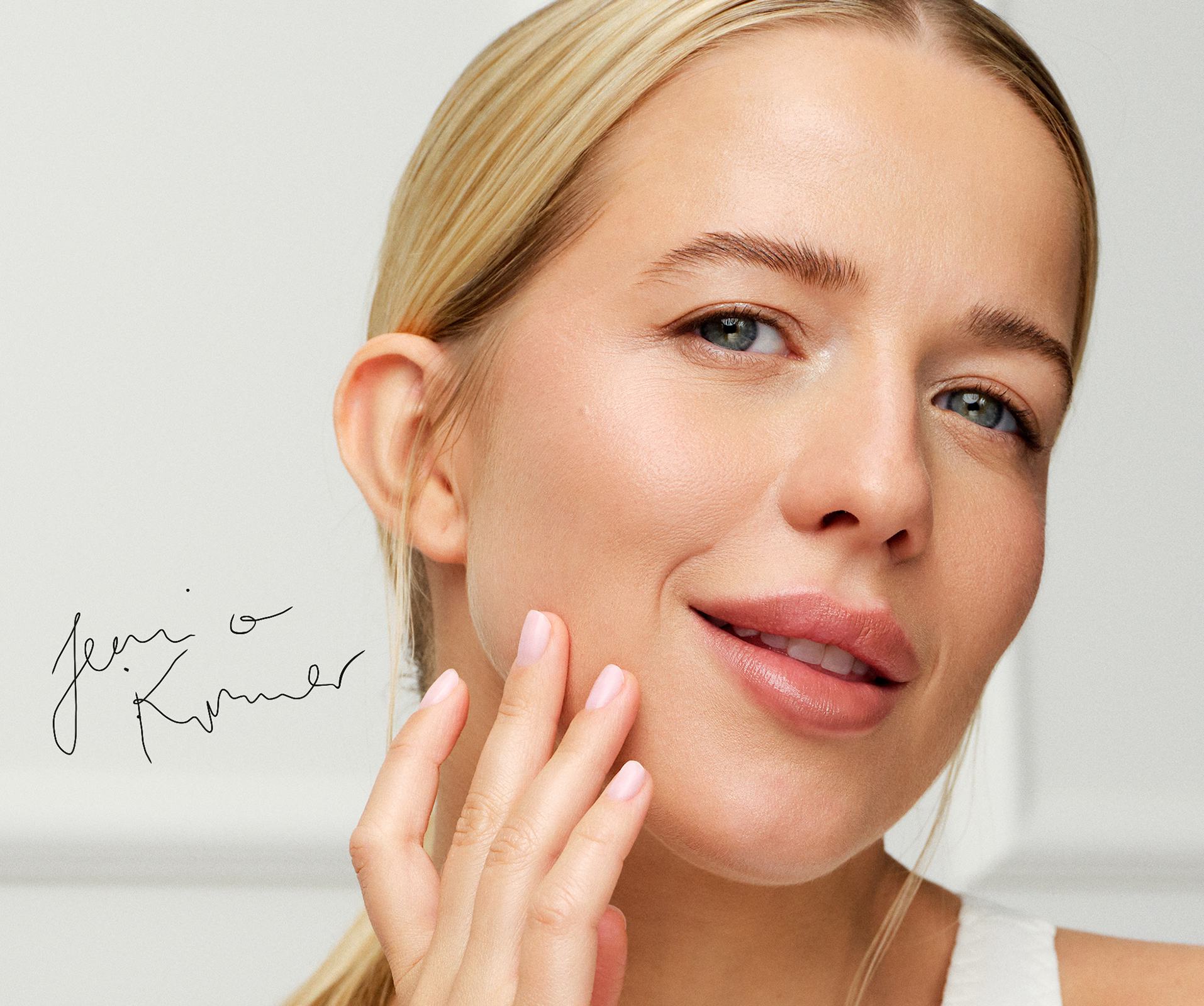 a woman touching her face