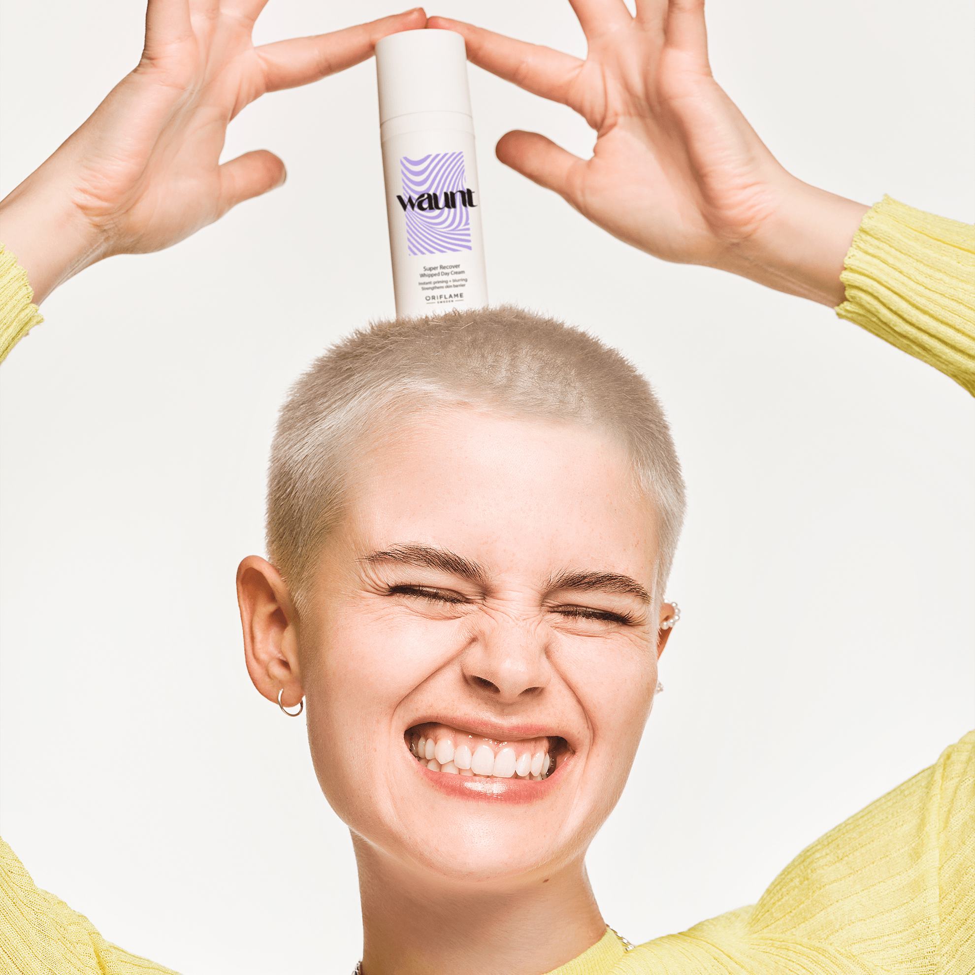 a woman with short hair holding a white bottle on her head