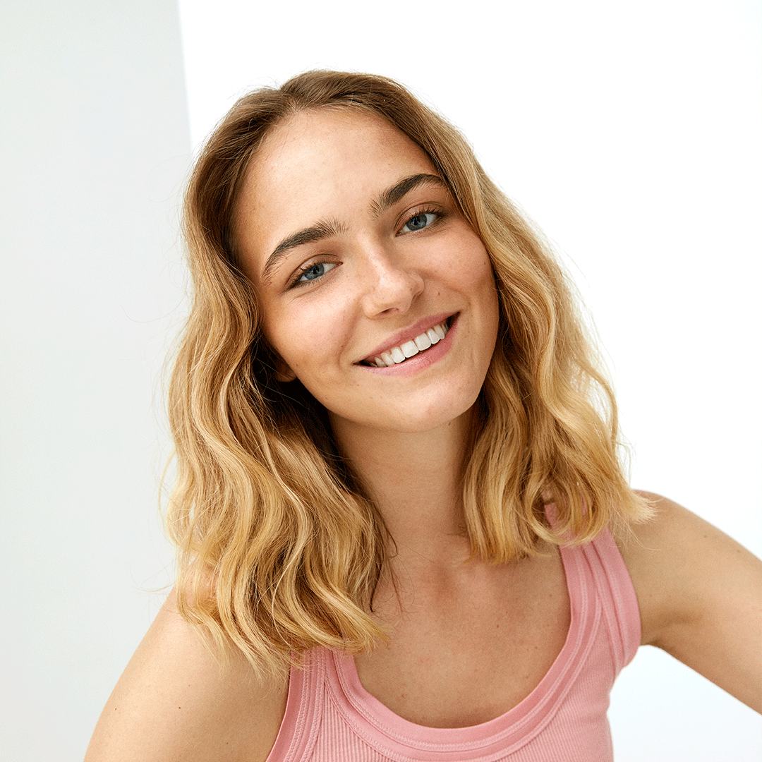 a woman smiling at camera