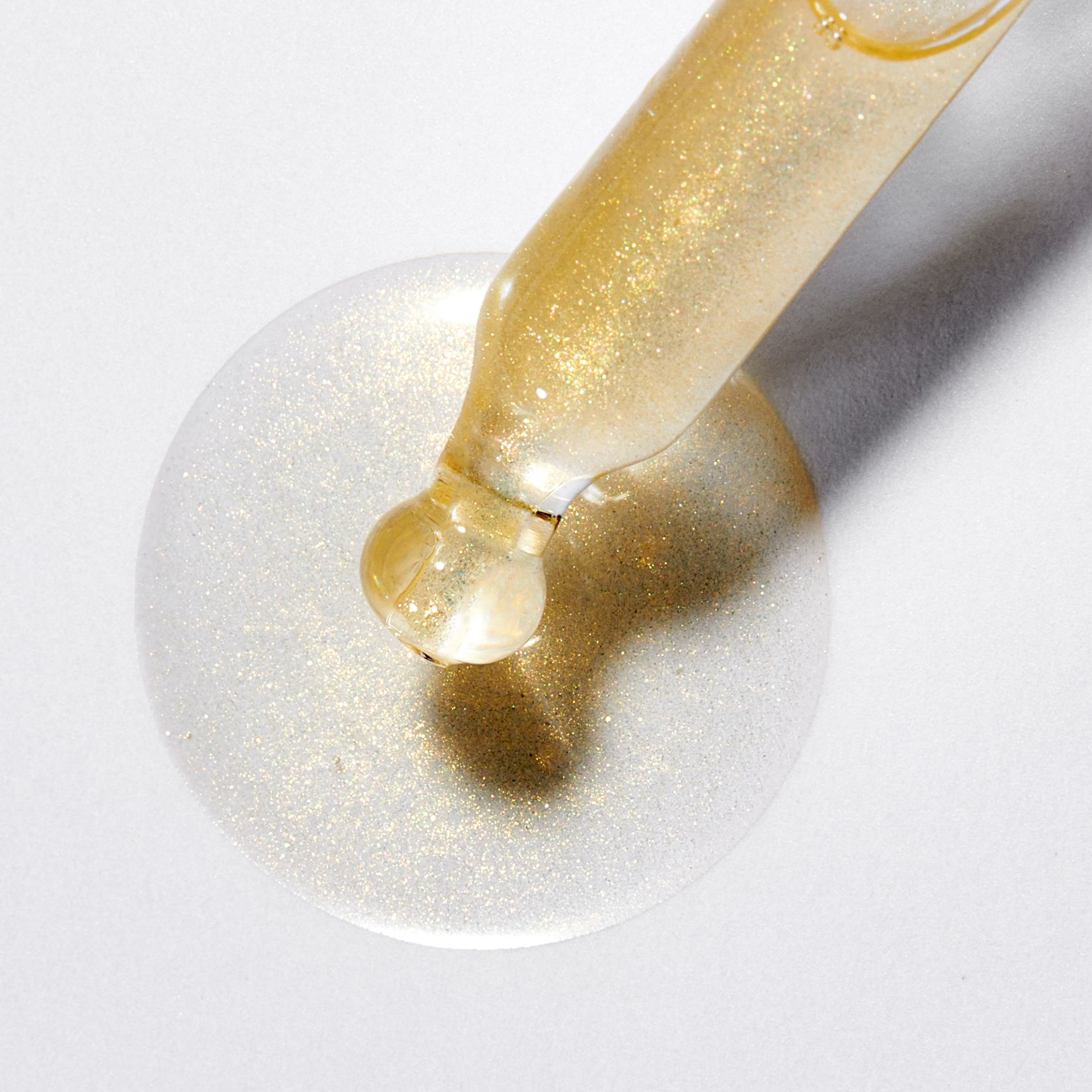 a dropper with a drop of liquid