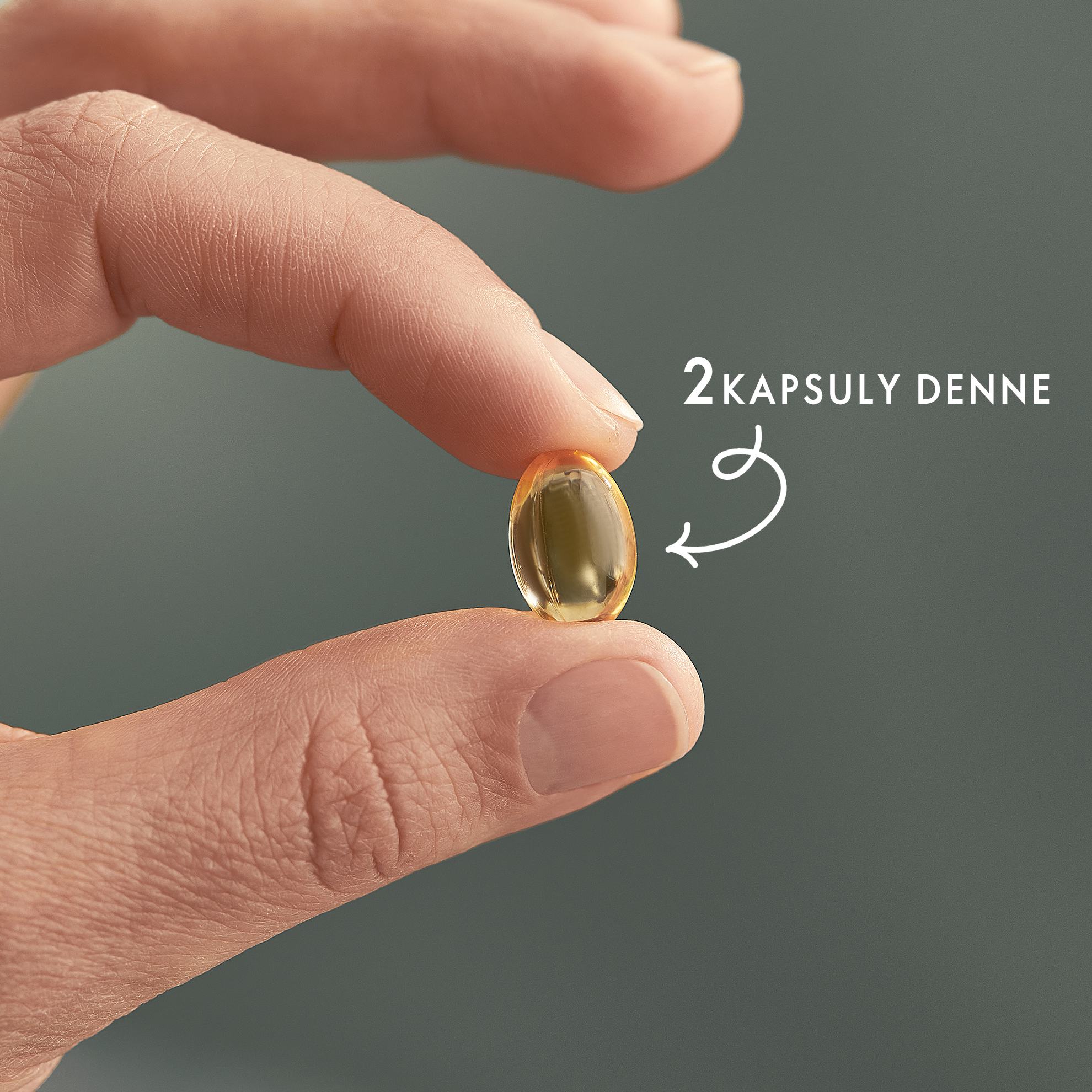 ruka držiaca tabletku