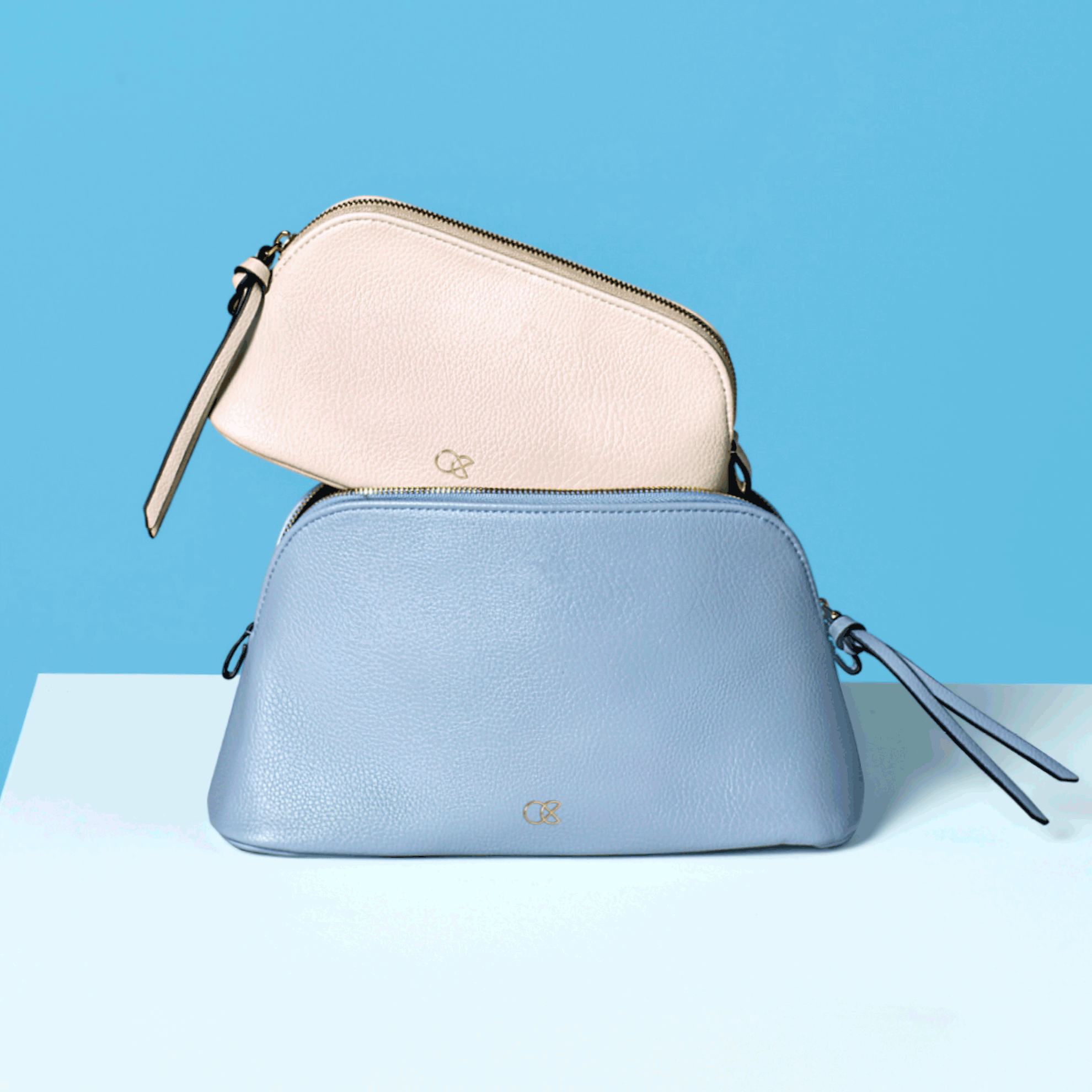 a two purses on a table