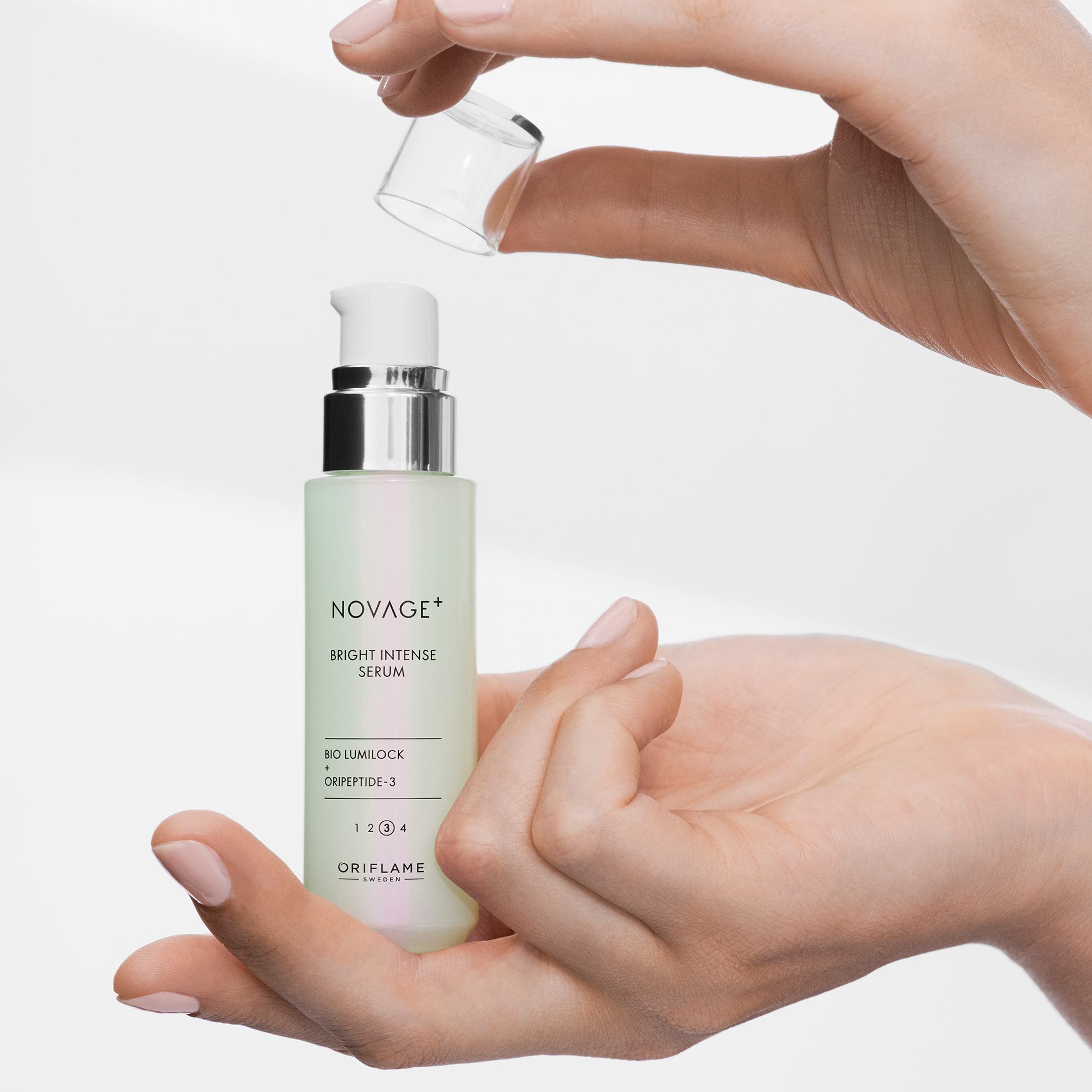 a person holding a small bottle