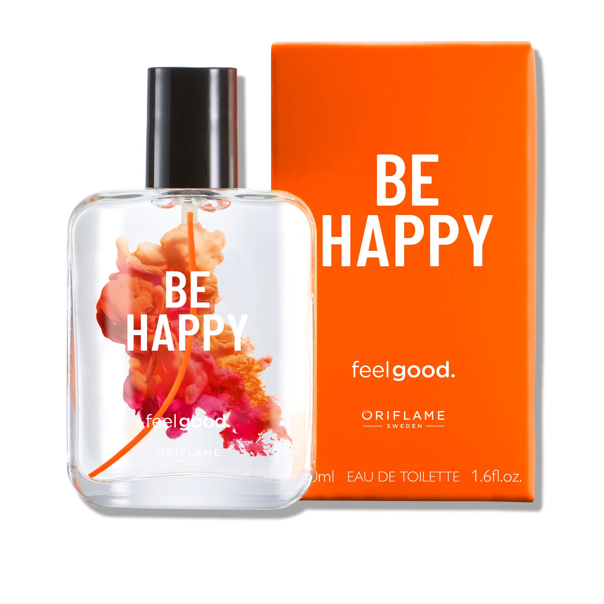 sebotol parfum di samping kotak jeruk