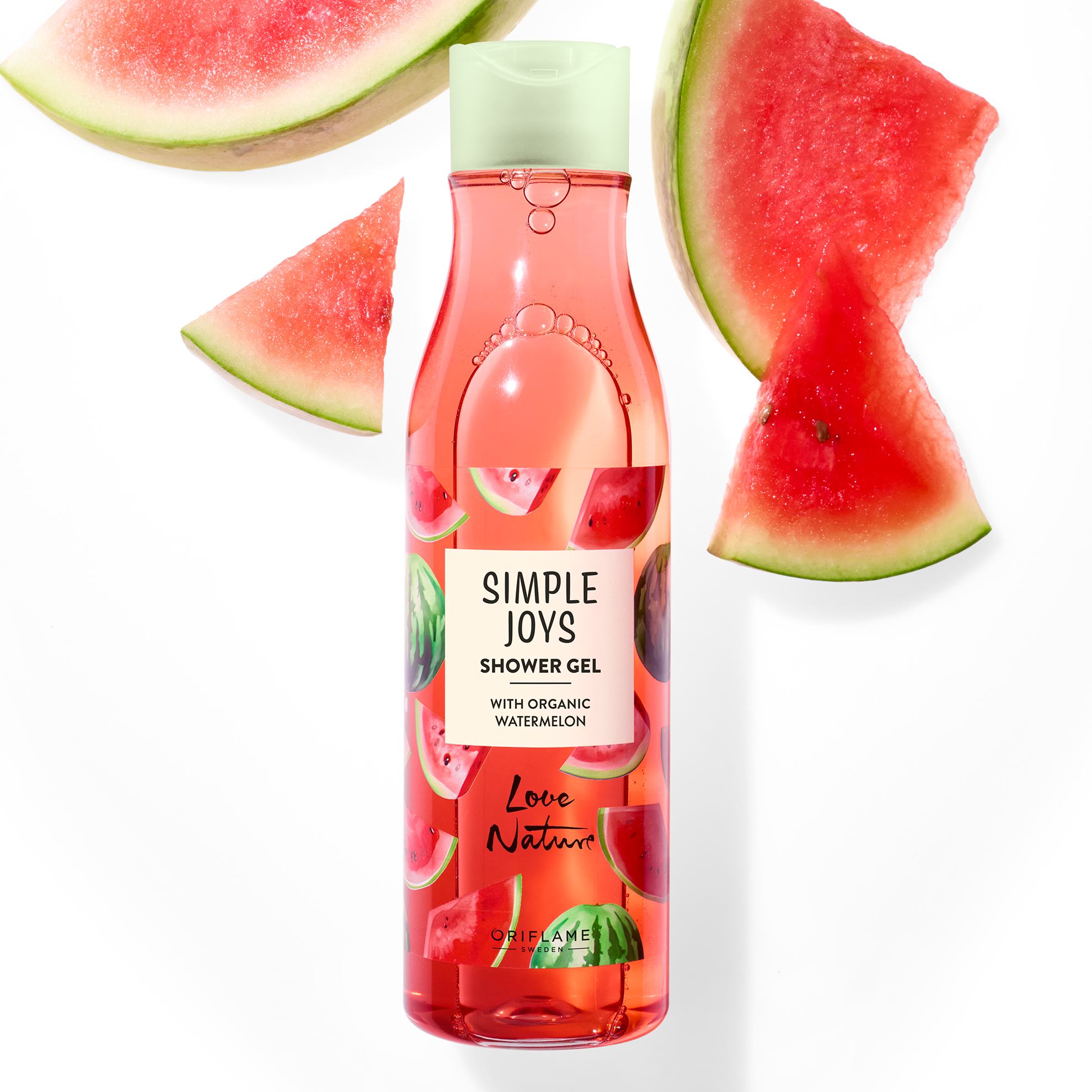 dušo gelio buteliukas šalia arbūzo gabaliukų