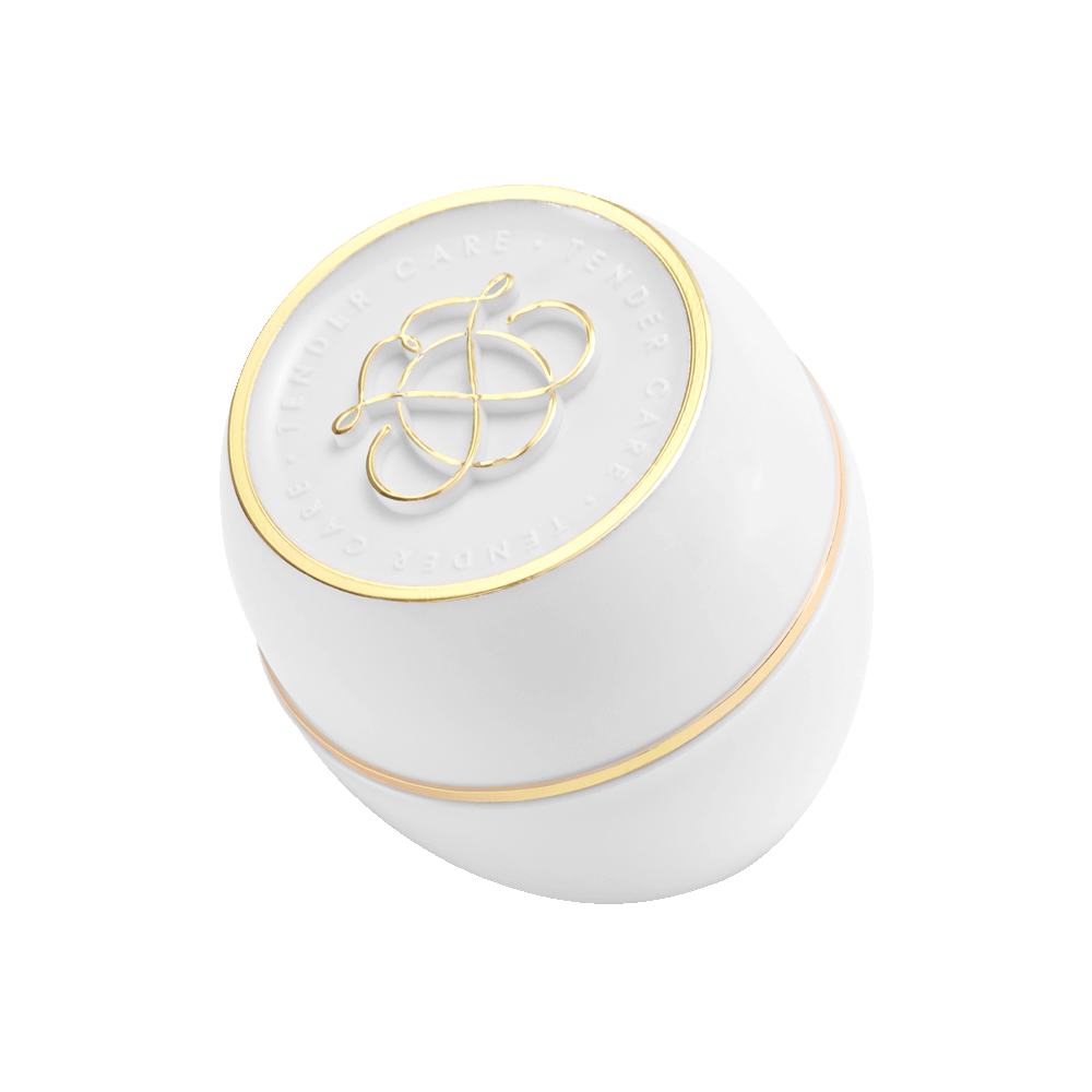 ένα λευκό και χρυσό δοχείο