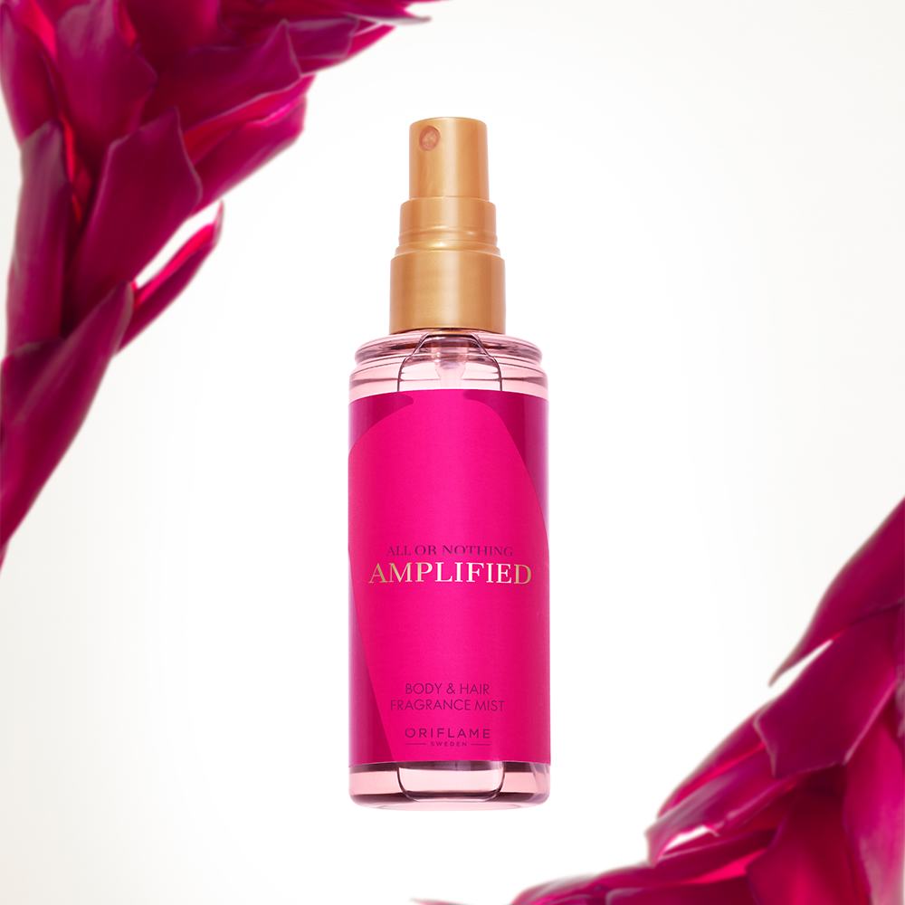 eine rosa Sprühflasche mit goldenem Verschluss