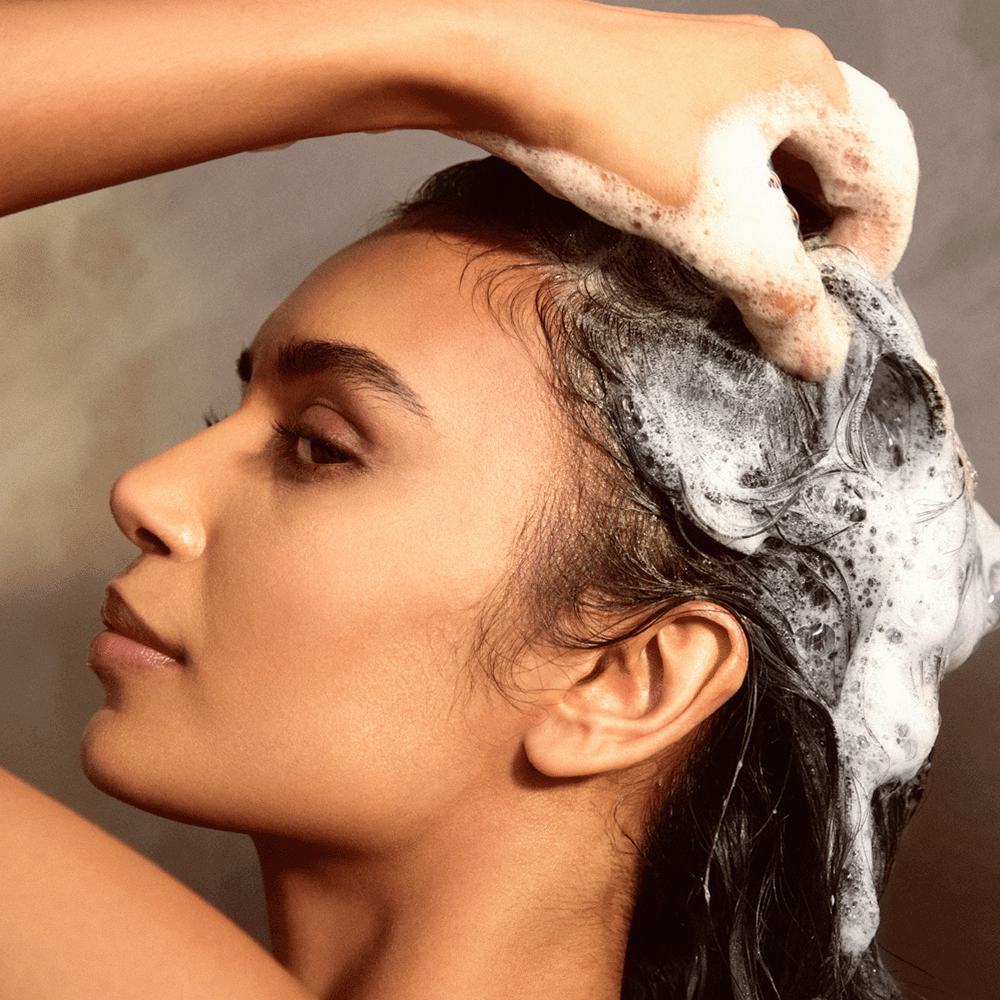 a woman washing her hair