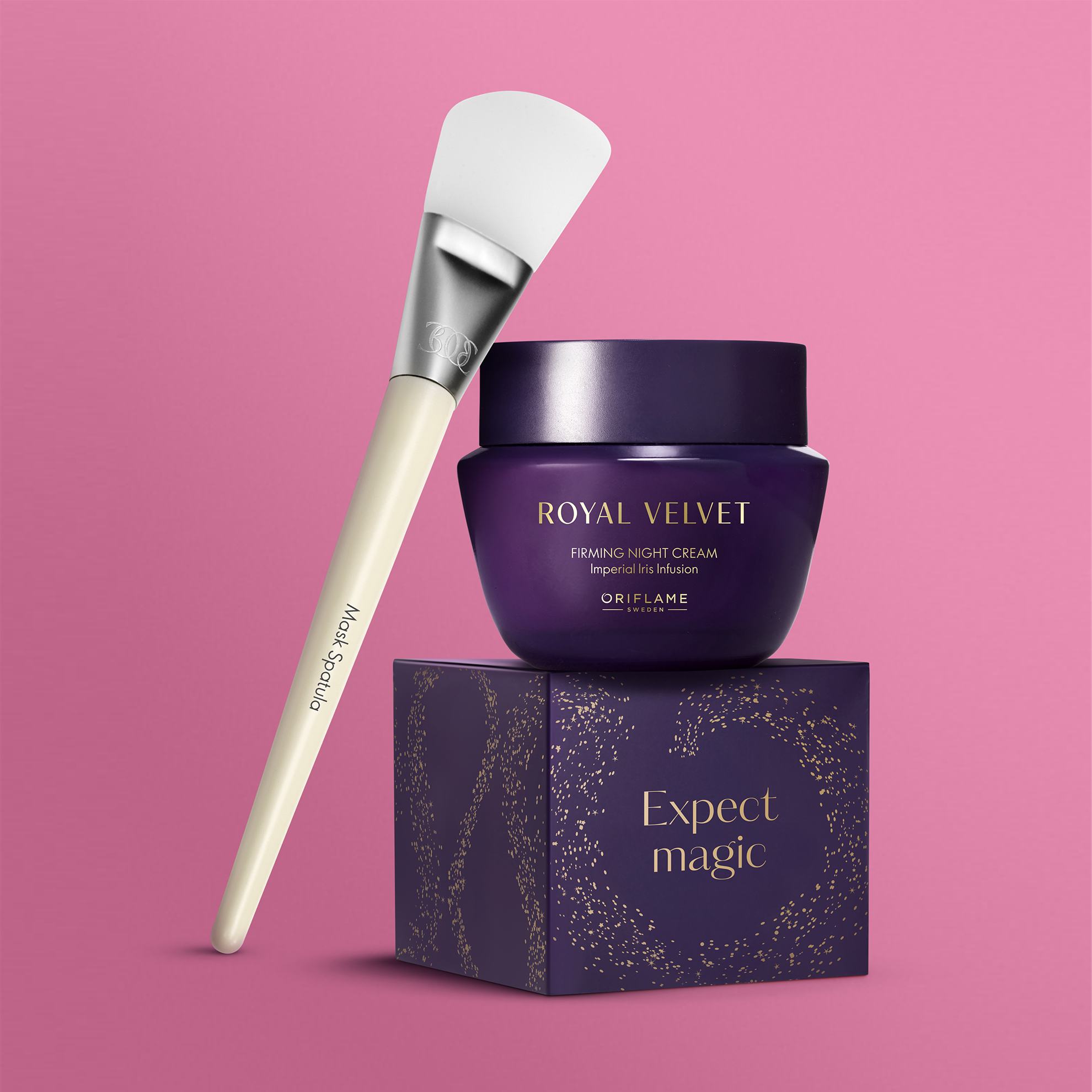 un recipient violet cu o perie albă deasupra