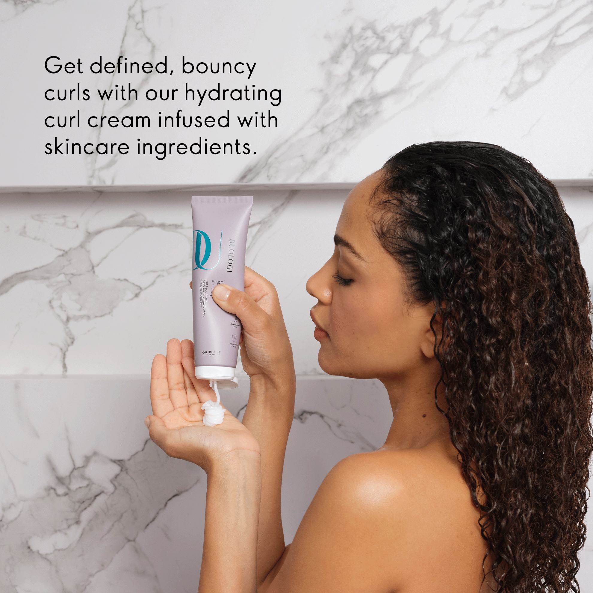 a woman holding a tube of cream