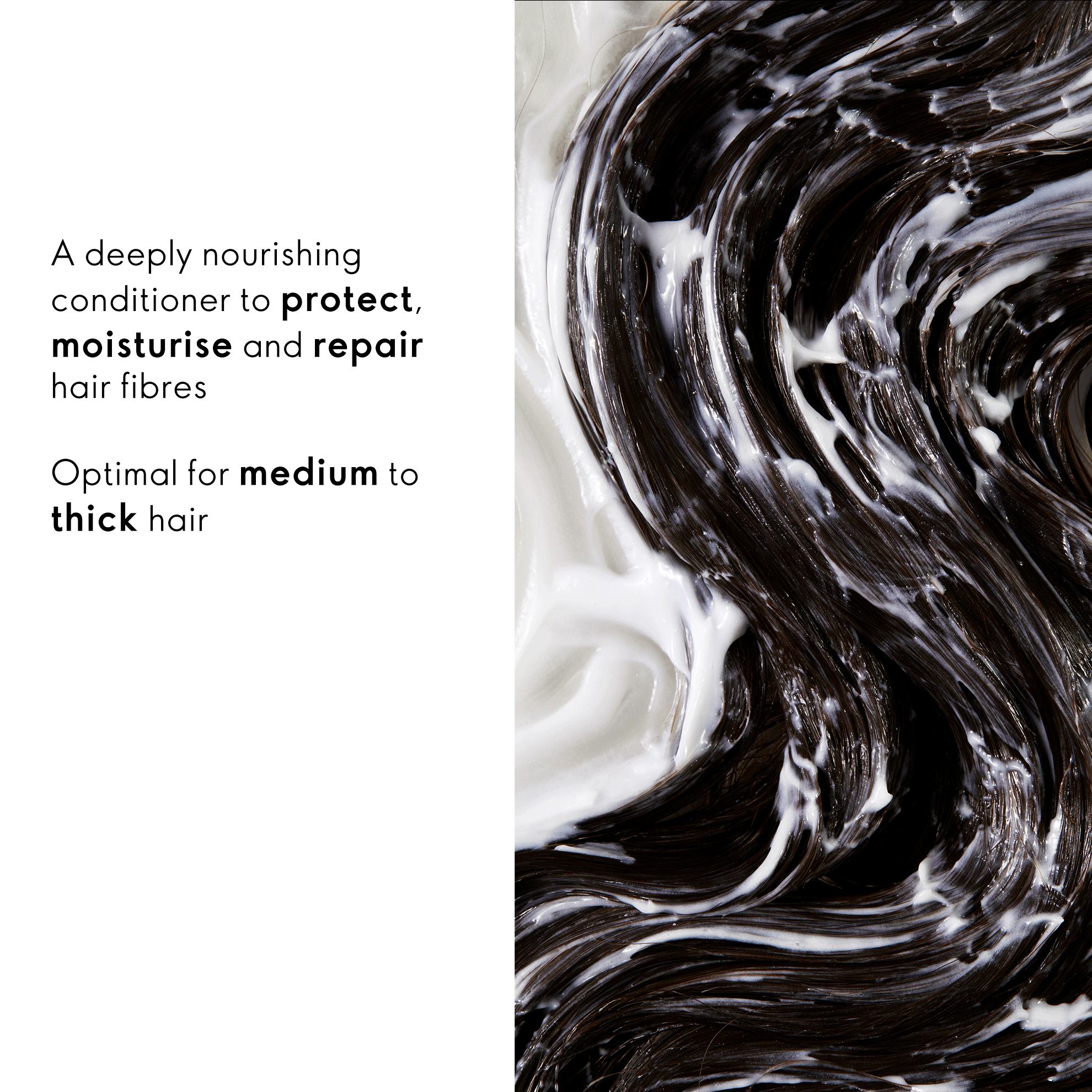 a close up of a black and white hair product