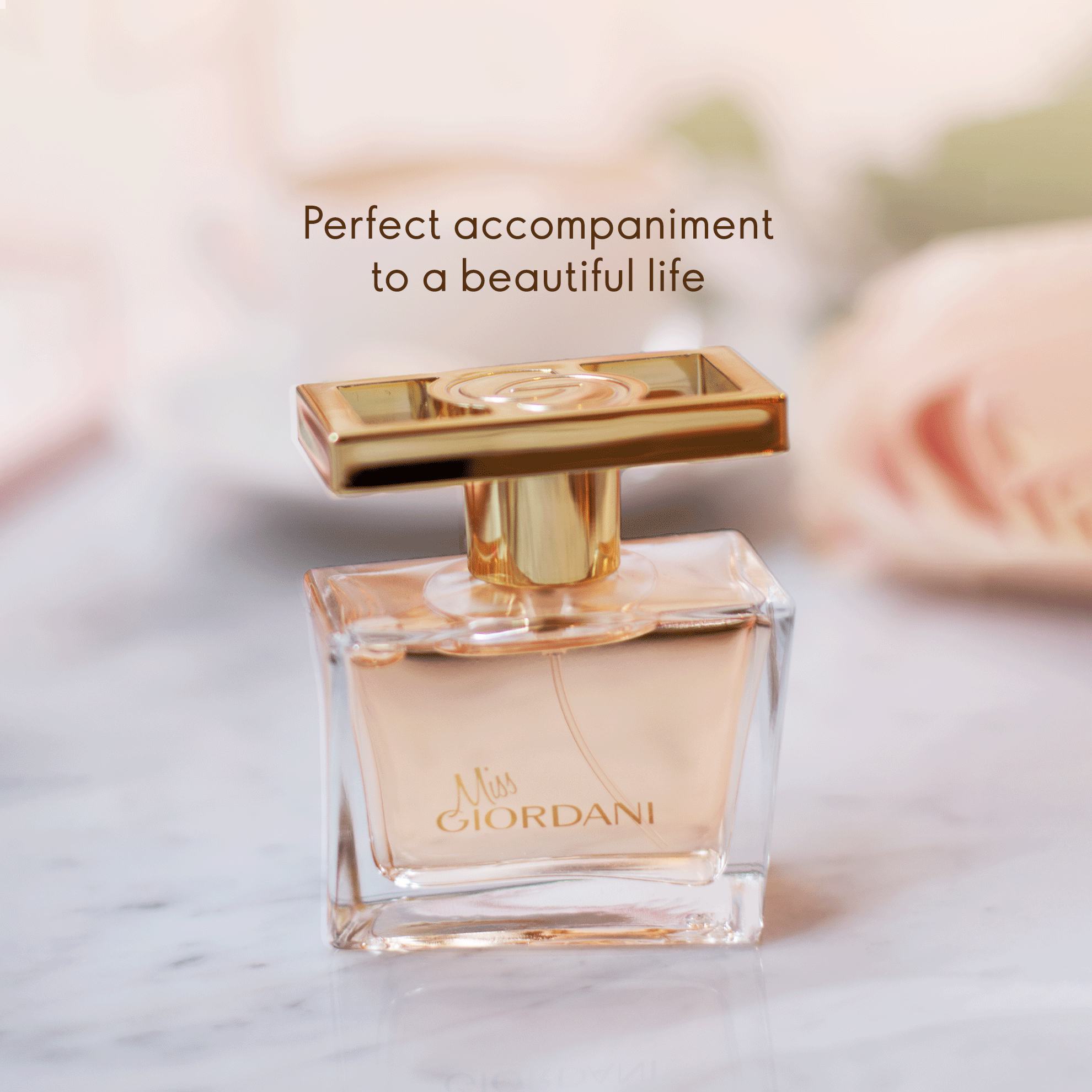 a bottle of perfume on a marble surface