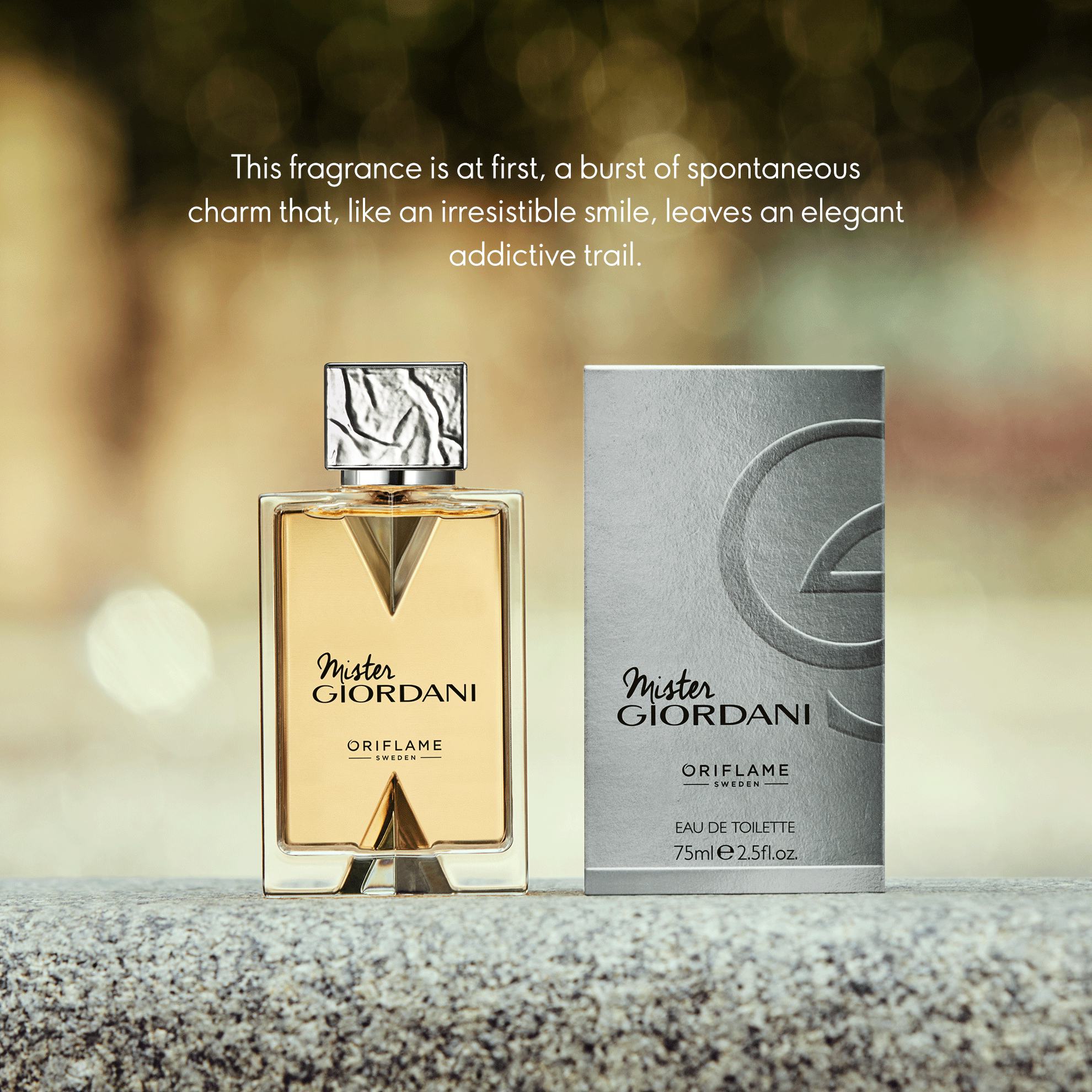 a bottle of perfume next to a box