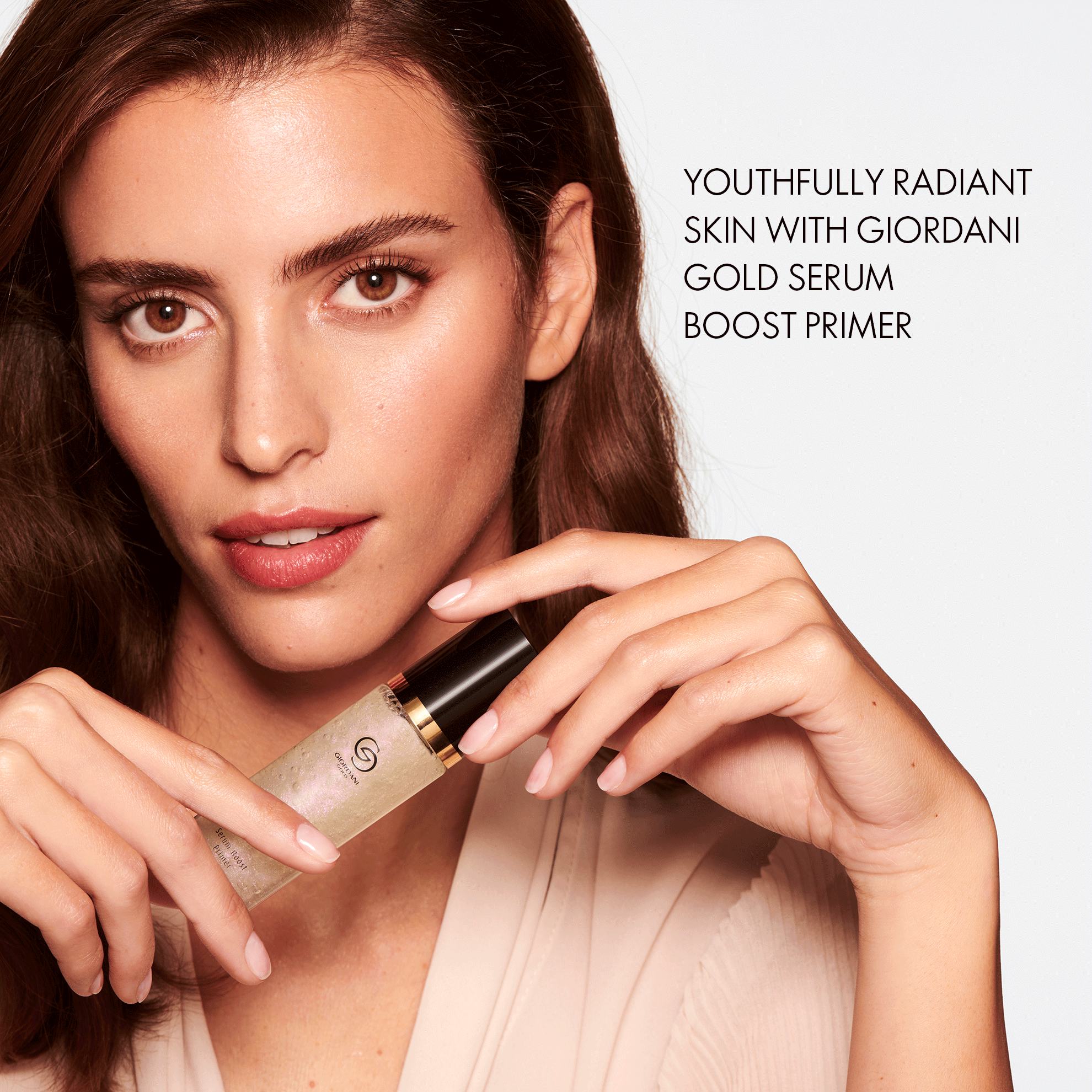 a woman holding a bottle of liquid