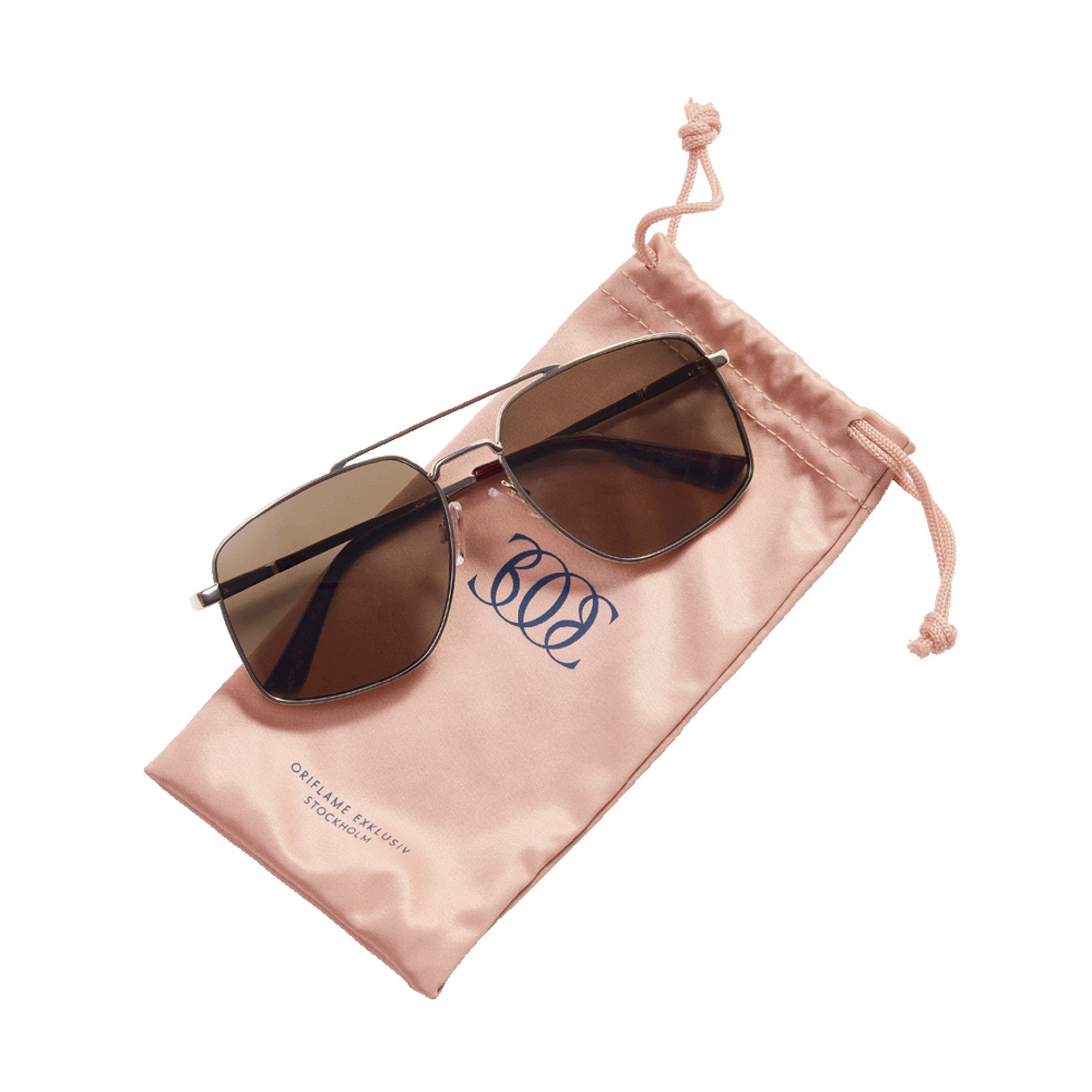 a pair of sunglasses on a pink pouch