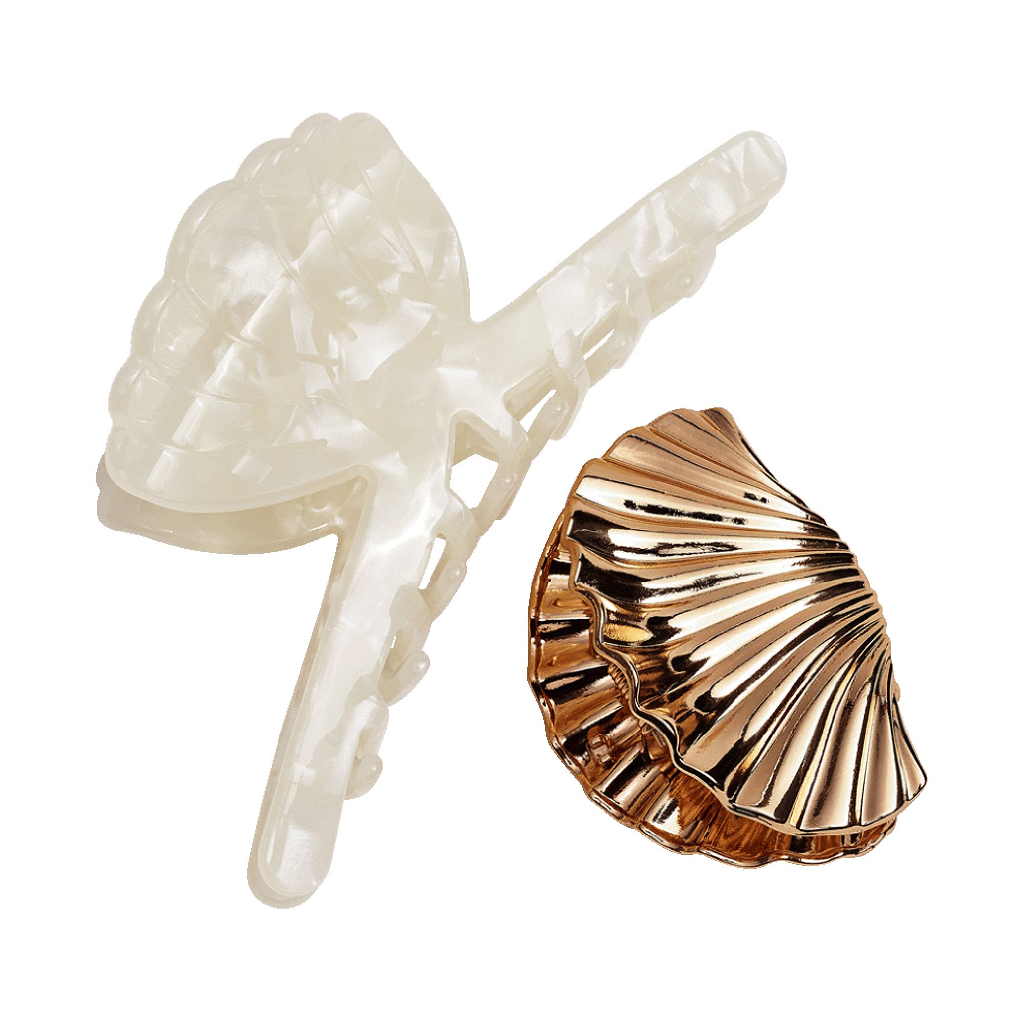 a white hair clip and a gold hair clip