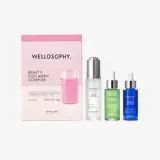 a group of bottles next to a pink box