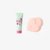 un tube de crème à côté d'un objet rose en forme de cœur