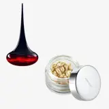 un borcan de cremă și o picătură de lichid