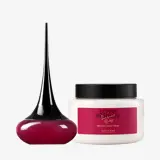 Sebotol krim dan cairan berwarna pink