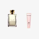 un flacon de parfum à côté d'un tube de crème