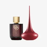 sebotol parfum di samping benda berwarna merah