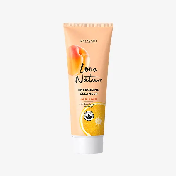 a tube of cream with orange fruit on it