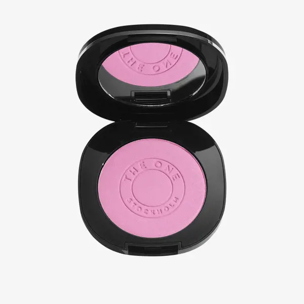un fard à paupières rose dans un étui noir