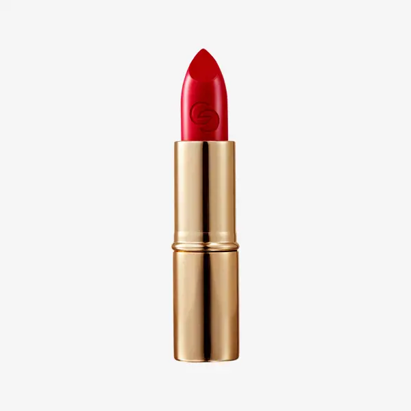 a red lipstick in a gold tube
