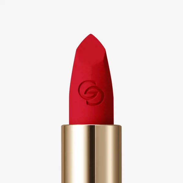 a red lipstick in a gold tube