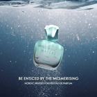 a bottle of perfume under water