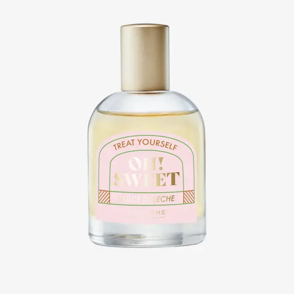 a bottle of perfume with a pink label