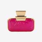 rožnata steklenička parfuma z zlatim okrasom