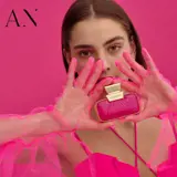 a woman holding a pink purse