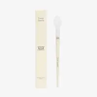 a white brush with a white box