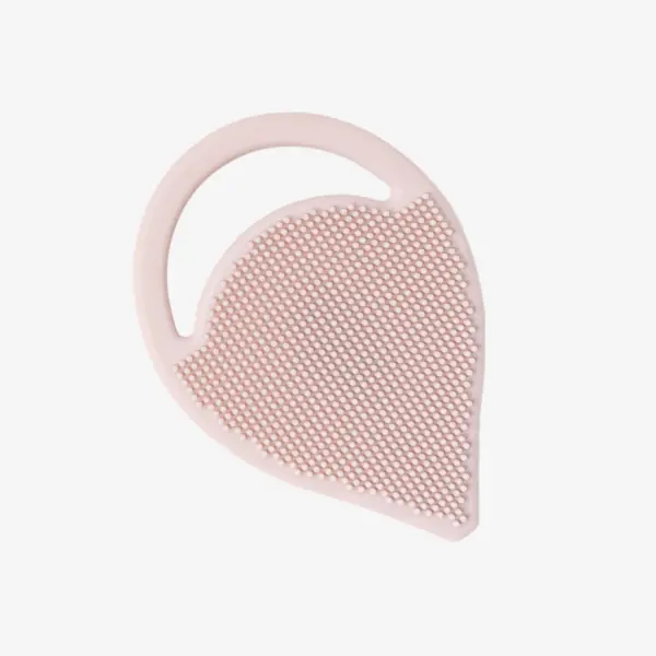 a pink and white massage brush