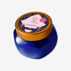 un pot bleu avec un couvercle doré