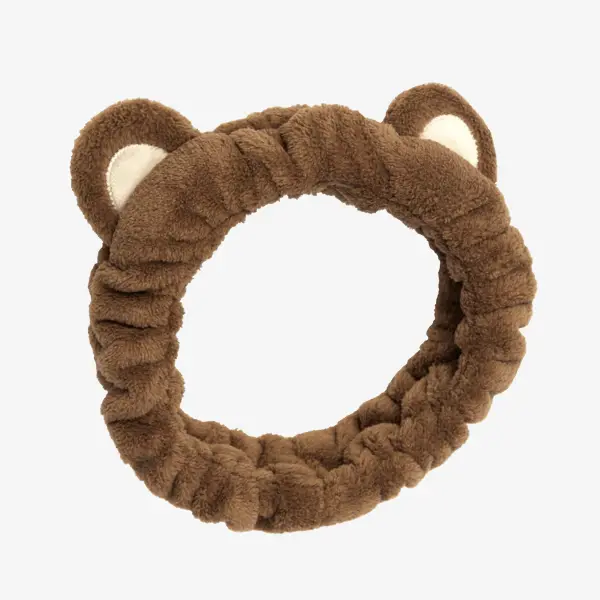 una cinta de pelo marrón con orejas